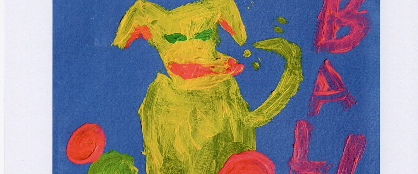 a painted yellow dog surrounded by colourful balls and the text "THE DOG LOVES BALLS"